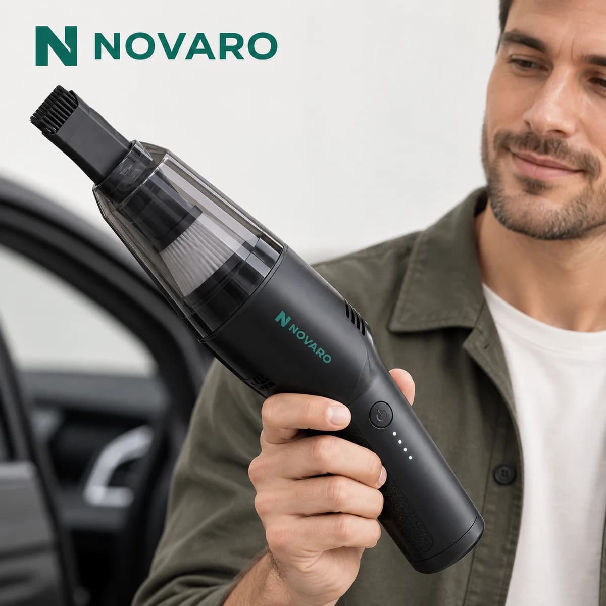 Man holding the NOVARO Cordless Car Vacuum with brush nozzle beside his car